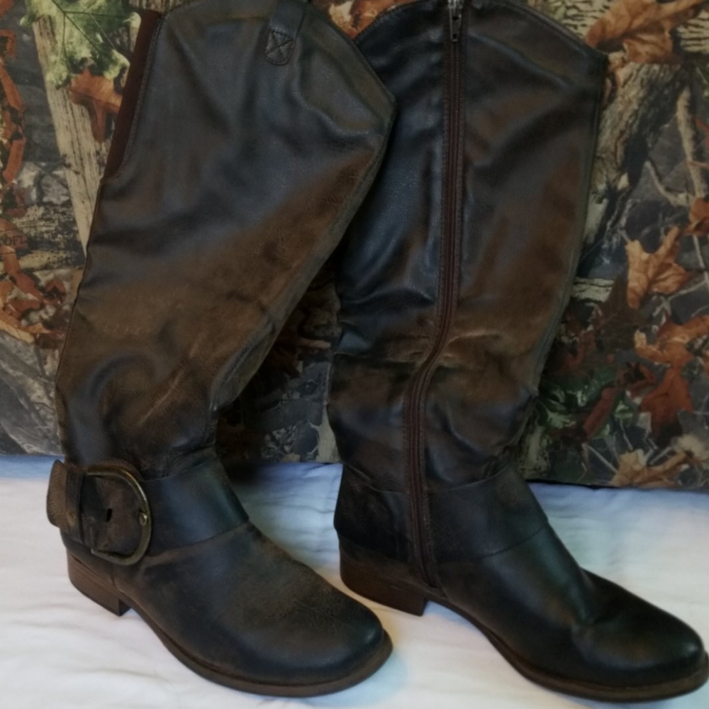 Brown vintage looking knee-high boots.